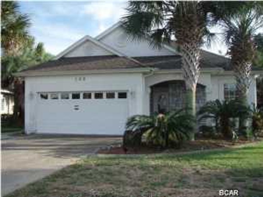 Stucco & stone home within walking distance of the beach and a short drive to Pier Park Great opportunity to own a home in the much desired Summer Breeze, one of the few neighborhoods that is golf cart friendly and has sidewalks for safety. This home has a split floorplan with Jack & Jill bath between the 2 spare bedrooms. The master bedroom has a large bath with garden tub, seperate shower and private toilet. The galley style kitchen leads to a pantry and the laundry room and has overhead cabinets and bar looking toward the open dining/living room with fireplace. There is a screened in patio that leads to the back yard with lush palms and an inground pool (12x24) with lots of patio room for grilling and lounging.