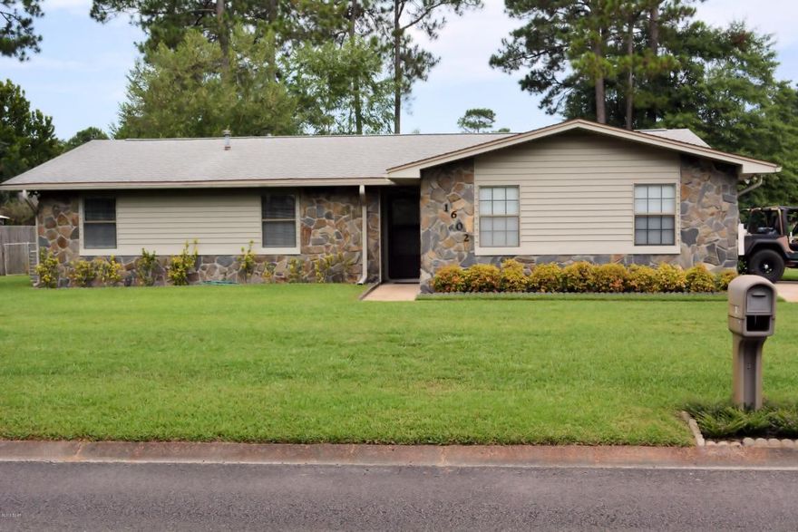 Looking for an affordable home in the Lynn Haven area?  Look no further than Derby Woods and this exceptionally maintained home.  Situated on a corner lot with excellent curb appeal, this ranch style home features a side entrance garage, fenced backyard, and a large screened in patio. Once inside, you'll appreciate the extra large living area with fireplace, separate dining room and the spacious galley style kitchen.  You'll also appreciate the oversized bedrooms.  The master bedroom is complimented with a private bath and walk in closet.  Affordablely priced and in move in condition, so don't delay see it today because this gem won't last long.  All sizes are approximate, so please measure to be sure.