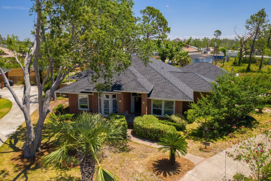 'CURRENTLY UNDER CONTRACT, SELLER ACCEPTING BACKUP OFFERS'ALL BRICK HOME nestled in a cul-du-sac has a large, deep pool with a diving board in a very big back yard! The formal dining room will hold a huge table, or it can be used as a formal living area, if desired. The kitchen, open to the family room, will hold all your guests, since that is where everyone ends up anyway! There is lots of breakfast bar space for seating, countertop space for food prep and cabinets for storage. The kitchen also features stainless appliances, to include double ovens and a desk area. Kitchen and Breakfast Room floors are wood look tile both beautiful and practical. The family room has a beautiful woodburning fireplace with a travertine and marble surround, dramatic 14ft ceiling and under the wall to wall ca you prefer. French doors open to a lush New Orleans style garden patio area on one side of the kit and the Florida room and Pool Area on the other.  The Fl room has wonderful storage for books, games or dvds and a sliding ladder to reach the top shelves. Off the kit and formal dining room is a sitting room/office or 4th bedroom with a sliding barn door, if needed. The Master Bedroom features wood floors, French doors with transom windows and a lovely trey ceiling. The master bath includes double sinks and dressing table, inviting soaking tub under the bay window, walk in shower and his & her closets complete this expansive space. The entire home has high end architectural finishes including: 10 to 14-foot ceiling heights, arched doorways, transom windows, crown moldings, trey ceilings and French doors. You will definitely want to add this home to your must see list!