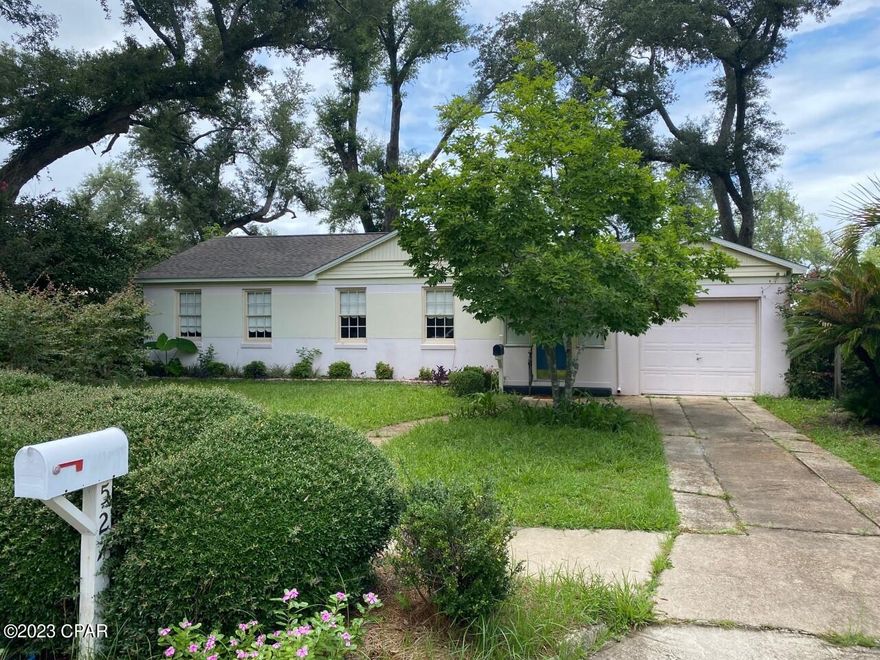 Fantastic Cove Cottage!  This cute 2 bedroom 1 bath Cove home is centrally located in Panama City on a large lot with lots of trees, flower beds, and shrubs. The large back yard is completely fenced, and includes a small deck. The roof was replaced in 2019. This home is ready for your finishing touches to make it your own! All measurements are approximate, please verify if important.