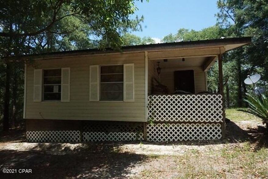 ****Highest & Best due Thursday Oct 28th 6PM CST**  1 acre Waterfront lot in the gated community of Leisure Lakes with a community pool, pavilion,  dock, play area, and more.  Convenient to town and the beach.   Lakefront home with 2 bd, 1 ba that has a large covered porch to sit and watch the fish jump.  Don't want to miss this one.  Call today for your private showing.