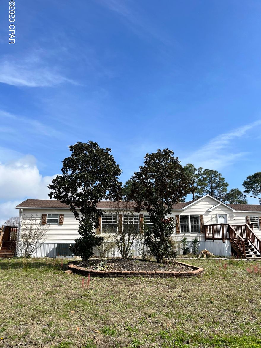 Located just off North Lagoon, this home is within minutes from the white sandy beaches. New HVAC and replaced ductwork in 2022 so most TLC is cosmetic. Split floorpan with two separate closets AND bathrooms. This unique floor plan has two separate full bathrooms in the master bedroom, one with a shower and one with a garden tub. The open concept has a large living room with a wood burning fireplace. The kitchen has an island with a large pantry right off of the kitchen. The laundry room is quite large and equipped with a sink, plenty of storage room and has a refrigerator that conveys with the property. This home needs a lot of TLC but don't let that stop you from making this your new vacation home! 

If important, info and measurements should be verified.