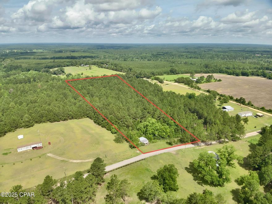 Discover the potential of this 7.29-acre wooded property located at 1580 Malcom Taylor Road in Bonifay, Florida. Tucked away in Holmes County's peaceful countryside, this parcel offers the perfect blend of privacy and accessibility—just 3 miles from Florida Highway 79 for convenient travel to nearby towns and the Gulf Coast.

The land is primarily wooded with mature trees, offering shade, beauty, and a natural buffer from neighboring properties. Whether you're dreaming of a private homesite, weekend getaway, or future investment, this property provides a blank canvas to make it your own. An older mobile home sits on site and will require removal or teardown, allowing you to start fresh with your own design.

Enjoy the quiet, rural lifestyle while still being within reach of modern amenities. With approximately 300 feet of road frontage on a well-maintained dirt road, easy access to power, and no HOA restrictions, this is an ideal spot for building your dream home, cabin, or hobby farm.