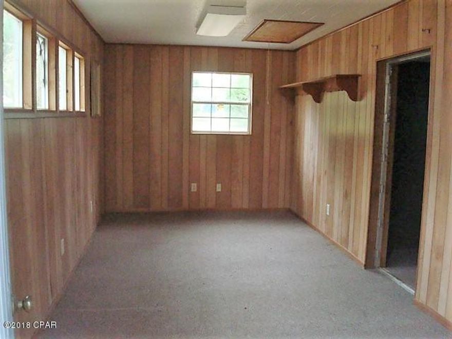 This .5 Acre Commercial Zoned Parcel, is ready for new owners. 

The lot has a power pole and a 20'x20' Workshop that could be turned into an efficiency or office space. 

It is plumbed for services but no water or sewer is on site. Can be connected. 

This is a prime location and has lots potential.  Consists of 3 city lots totaling just over 1/2 acre

Call today to schedule your private tour.