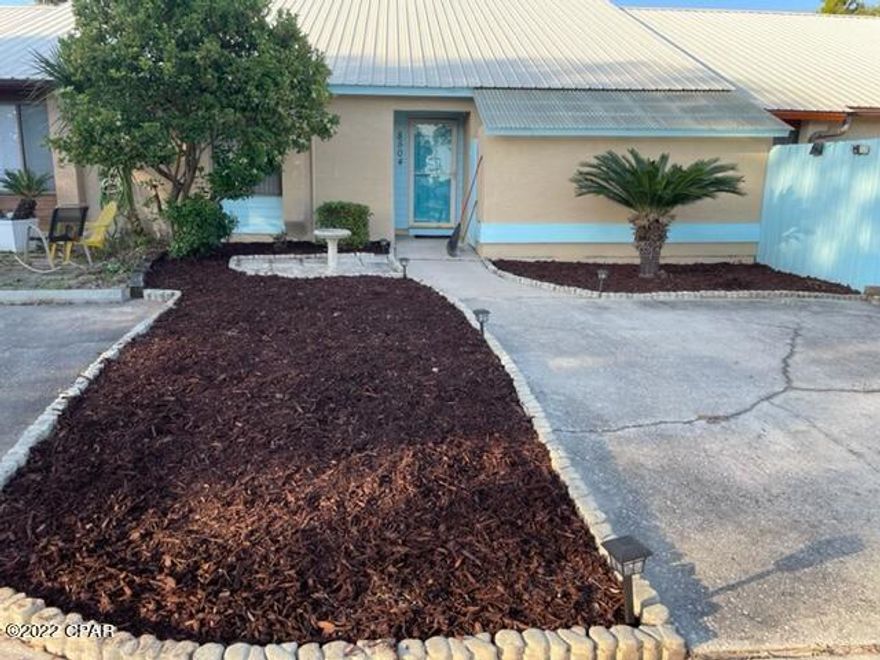 Great find on North Lagoon--One level, no HOA, and close to the beach! Updated 2 bedroom 2 bath, large kitchen with sliding glass doors to covered patio. New roof after Hurricane Michael and new hot water heater. The large Master bedroom also has a sliding glass door to a covered patio with large fenced deck and HOT TUB! Two parking spaces in front of unit, additional spaces available between N Lagoon Dr. and common driveway. Ready to add your personal touch, come and tour before this East end gem is gone!