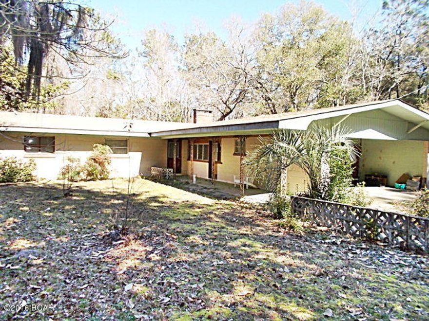 PRICE REDUCED! Large home on 10 ac in the rolling hills of Chattahoochee, this home is just out of town but very private living, natural woods surround the home, large living room, large dining room with a bonus room just off living room, master bedroom with tile bathroom,carport, workshop, needs a little TLC but is priced to sell. Call agent to view this home.