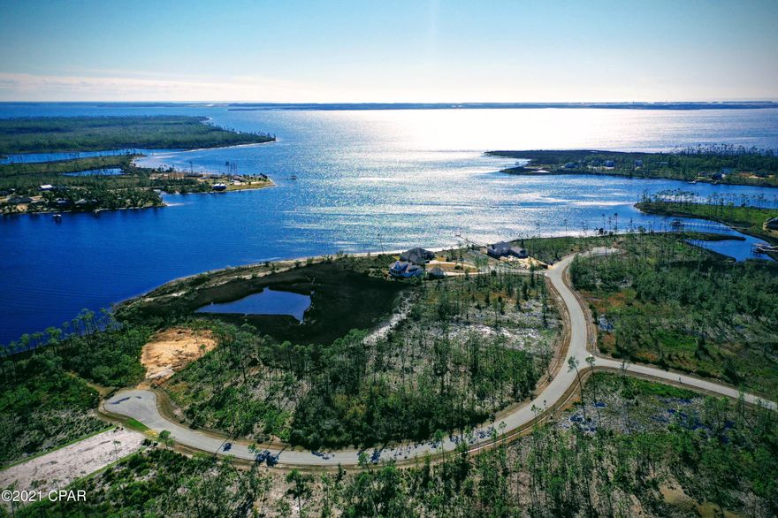 1019 Reel Easy Drive could there be a better name for an address? The style of living is as relaxing as the name of the street. Laird Bayou, .6 acres, gated, private, pool, peace and quiet living. Lot adjoins Laird Bayou and East Bay. BONUS - Laird Bayou features a private boat launch and dock as well as a gated boat/RV storage area for all owners! Don't settle for low inventory, build the home you want today and come home to sunsets, nature and spectacular bay views today!