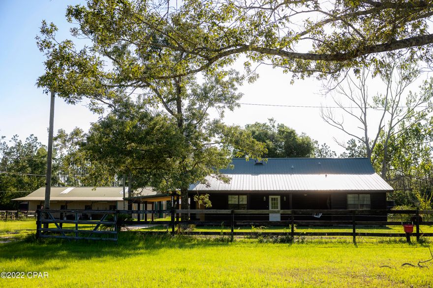 Check out this stunning cabin situated on 4 acres! Located conveniently off of Highway 388, this newly restained log cabin is just the beginning of what this property has to offer. Completely fenced, this property comes complete with an enormous 2,640sqft 5-stall horse barn that can be turned into a 7-stall horse barn with a hay barn located directly behind it. This property also includes a 40x28 storage building.