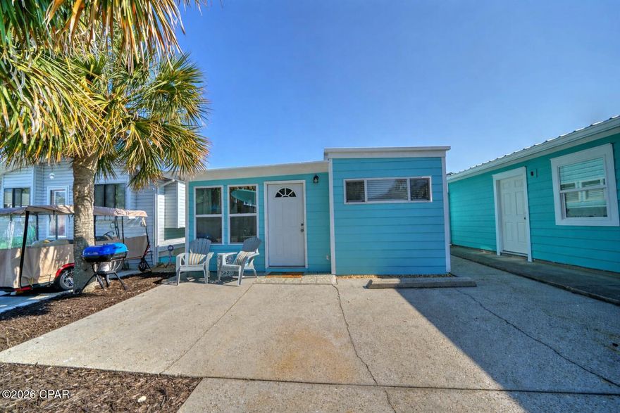Welcome to your perfect beach getaway in the highly sought-after gated community of Venture Out in Panama City Beach. This adorable 2-bedroom, 1-bath home offers the ideal blend of comfort, functionality, and coastal charm--perfect as a vacation rental, second home, or full-time residence. 
Step inside to a bright and inviting living space featuring beachy décor, abundant natural light, and an open, airy feel. The spacious living room flows seamlessly into the dining area and kitchen, creating a welcoming layout for relaxing or entertaining. The kitchen is fully equipped with ample cabinetry and workspace, making meal prep a breeze.  The home offers two comfortable bedrooms, including a generously sized primary suite, providing plenty of space for family and guests. Thoughtful touches throughout enhance the cozy coastal vibe.  Outside, enjoy your private patio area--perfect for morning coffee or unwinding after a day at the beach. The property also offers convenient parking and low-maintenance outdoor space. 
Located in Venture Out, a golf-cart-friendly community with private beach access to the Gulf of Mexico and access to Grand Lagoon, residents enjoy incredible amenities including two pools, tennis, pickleball, basketball, a fishing pier, boat launch, playground, and 24/7 gated security. 
Just a short golf cart ride to the World's Most Beautiful Beaches, and close to local marinas, dining, and shopping, this property offers the ultimate coastal lifestyle. Don't miss this opportunity to own a slice of paradise in one of Panama City Beach's most popular resort communities!