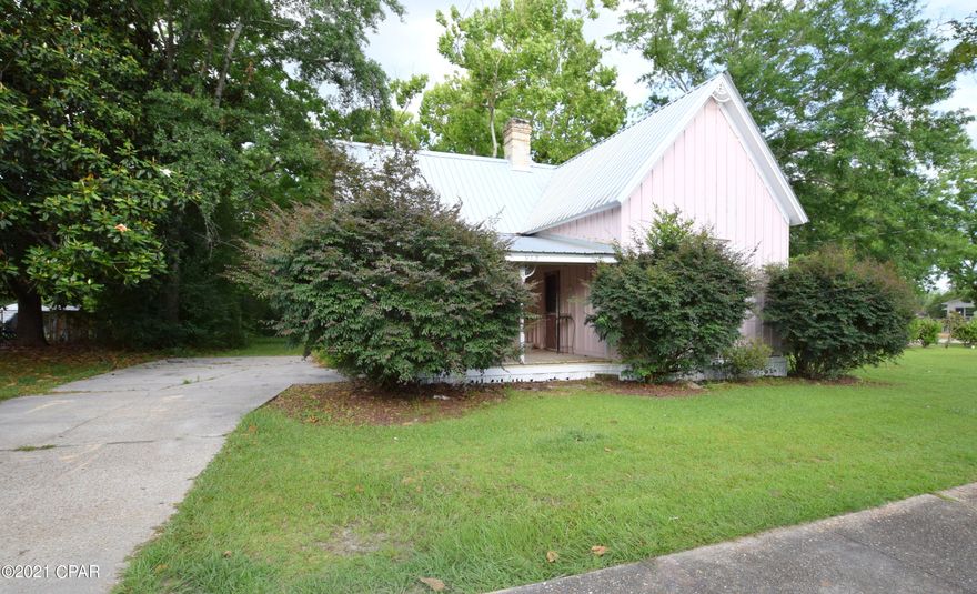 Currently zoned Neighborhood Commercial this rare find located directly off Hwy 77 has endless possibilities. Previously used as a school this building boast over 1300 sq ft with full kitchen and bath, two large office spaces, front and rear porches and metal roof installed in 2015. Purchase includes an additional lot behind the building that allows direct access from either Hwy 77 or 7th St. Property is located just south of Hwy 90 off Main St, a short drive to Interstate 10.