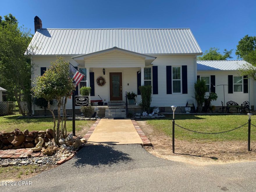 Beautiful country home sitting on over 74 acres!! Talk about character. The main house has four bedrooms, two baths which includes a huge loft that is 23 x12. 12 foot ceilings in the living and dining room, kitchen island, granite countertops, new AC being installed and roof is 3 years old, foam and blown in insulation, 18 x 15 cedar covered porch (repels bugs), 30 x 15 workshop/garage with a 20 x 24 lean to. Two sheds, 12x20 and 28x12. Two septic tanks and one well, Hard to find a country setting such as this home on a PAVED road. Also an ADDITIONAL 600 sf fully equipped, remodeled guest house that has two bedrooms and 1 bath. Pictures to come!!