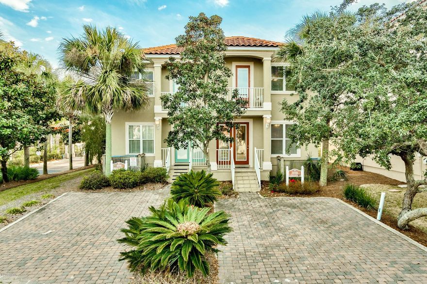 Fantastic home situated across the street from the beach within the gated community of La Valencia, a Mediterranean style complex with upscale amenities including a clubhouse with pool, lounge and fitness center and a beautiful Gulf front pool and sun deck to enjoy along with deeded beach access. Prime location on the west end of Panama City Beach close to Pier Park and prestigious communities of 30A. Upon entry you will notice beautiful wainscoting down the tiled hallway. This floor plan conveniently offers all 3 bedrooms downstairs and a spacious living & dining area, kitchen and bunk area upstairs to maximize the Gulf views. Capture the views from the interior or relax, dine & entertain on the outdoor balcony facing the Gulf. This would be a prime full time residence or vacation rental. The lower level master suite features direct access to a covered patio with slight Gulf views and backyard. There is a walk-in closet and en-suite bathroom with a Jacuzzi tub to unwind in, tile floors and a separate walk-in shower. The two guest bedrooms are also located on the first floor and share a bathrooms that can be accessed from either room or the hallway. There is an owners closet in the hallway downstairs which is an easy spot to stow beach gear and a laundry room with a full size washer & dryer. 

Hardwood stairs bring you to the upper level with the main living areas. The open floor plan and raised ceilings make this property great for family gatherings and entertainment. There is a breakfast bar seating four for a more casual setting and an additional dining area. The large open kitchen has white appliances and plenty of storage with the ample cabinets and pantry.  Need a little more sleeping space? No problem! There is a bunk room (complete with triple bunks!!) and a full bathroom upstairs as well. There is a Juliette balcony off this area to enjoy and a larger Gulf view balcony off the living area. Enjoy music outside while entertaining as there are surround sound speakers in and out of the home. Outdoor ceiling fans have been updated and exterior is in good shape - stucco recalled and painted last January. The living area is spacious with two couches and additional chair seating. Recessed lighting and high ceilings is an additional feature for this floor. The curb appeal is exceptional with tropical landscaping and a paver stone driveway. The subdivision is nicely maintained by the HOA and is a great community. Enjoy beach living and the coastal lifestyle everyone desires for an affordable cost. La Valencia has a tennis court, two pools (one beach side), deeded beach access and a gorgeous clubhouse with fitness room. This is an easy show and will not last long!