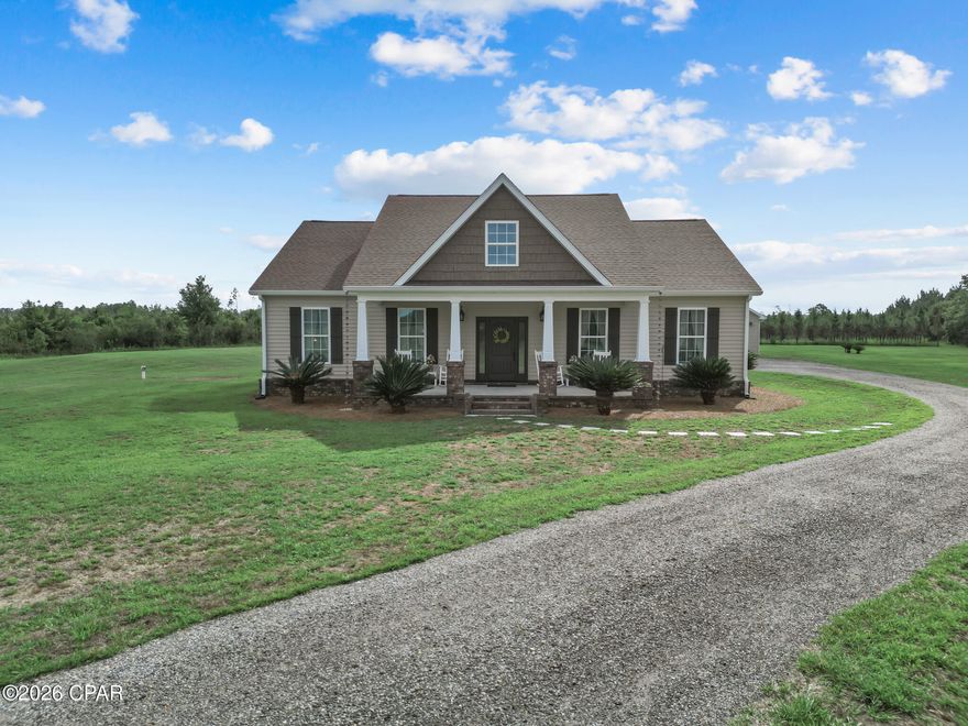 13811 SW Myers Dairy Rd, Blountstown, FL | Calhoun County
10 Acres | 3BD/2BA | 1,900 SF Heated | 2,860 SF Under Roof | 2019-Built | Workshop | No HOA

Modern country living rarely checks this many boxes. Built in 2019 on 10 scenic acres in Calhoun County, this refined rural retreat delivers quality construction, genuine acreage, and the kind of flexibility that's hard to find -- all without an HOA and with additional land available for purchase.
One of the home's most distinctive features is the custom cabinetry found throughout -- from the kitchen and bathrooms to the laundry room -- giving every functional space a cohesive, high-end finish that stands well above standard construction at this price point.
The 1,900 heated square foot home sits under 2,860 total square feet of roof, giving you a sense of just how substantial this property feels the moment you arrive. The layout is thoughtfully designed, with ceramic tile flowing through the main living areas and hardwood floors in the primary and second bedroom. The kitchen anchors the home with custom cabinetry, quartz countertops, a generous island, stainless appliances (stove, refrigerator, microwave, dishwasher), and a conveniently located pantry closet -- built for real use and designed to impress. A large laundry room with custom cabinetry and included washer and dryer keeps daily life organized and looking sharp.
The primary suite is a calm retreat, featuring custom cabinetry and an accessible-style shower in the en suite bath. Two additional bedrooms -- one with hardwood, one with luxury vinyl plank -- and a second full bath with custom cabinetry complete a practical, well-balanced floor plan. Central A/C and ducted heat provide year-round comfort throughout.
Step outside and the property earns its reputation. The extra-large 2-car garage is heated and cooled, making it as useful as it is spacious -- ideal for vehicles, equipment, a home gym, or flex space. A separate 1,040 SF workshop with approximately 370 cooled square feet, finished concrete floors, window A/C, convection heat, and a metal panel roof adds serious working and storage capability. The 10-acre parcel is a graceful blend of cleared ground, wooded areas, and landscaped space -- served by private well and septic, with no HOA restrictions.
Located approximately 57 miles from Panama City Beach, this is a rare opportunity: modern build, real acreage, custom finishes throughout every room, income-worthy outbuildings, and room to grow.
Schedule your private showing today.

3 BD | 2 BA | 1,900 Heated SF | 2,860 SF Under Roof | 2019 Construction | 10 Acres | Custom Cabinetry Throughout | Quartz Countertops | Pantry Closet | Extra-Large Heated/Cooled 2-Car Garage | 1,040 SF Workshop (~370 SF Cooled) | Well & Septic | No HOA | Additional Land Available