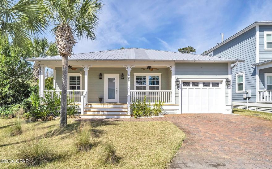 Coastal comfort meets convenience in this beautifully maintained 3-bedroom, 2-bath home nestled inside the gated community of Paradise Grove on the desirable west end of Panama City Beach. Located just half a mile from the sugar-white sands and emerald waters of the Gulf, this home offers the perfect blend of beachside living and everyday comfort.  Inside, you'll find updated laminate flooring throughout the main living areas, an open and inviting layout, and a spacious primary suite featuring a large ensuite bathroom with a relaxing jetted tub. Step outside to enjoy the outdoor kitchen, perfect for entertaining after a day at the beach or hosting sunset dinner
