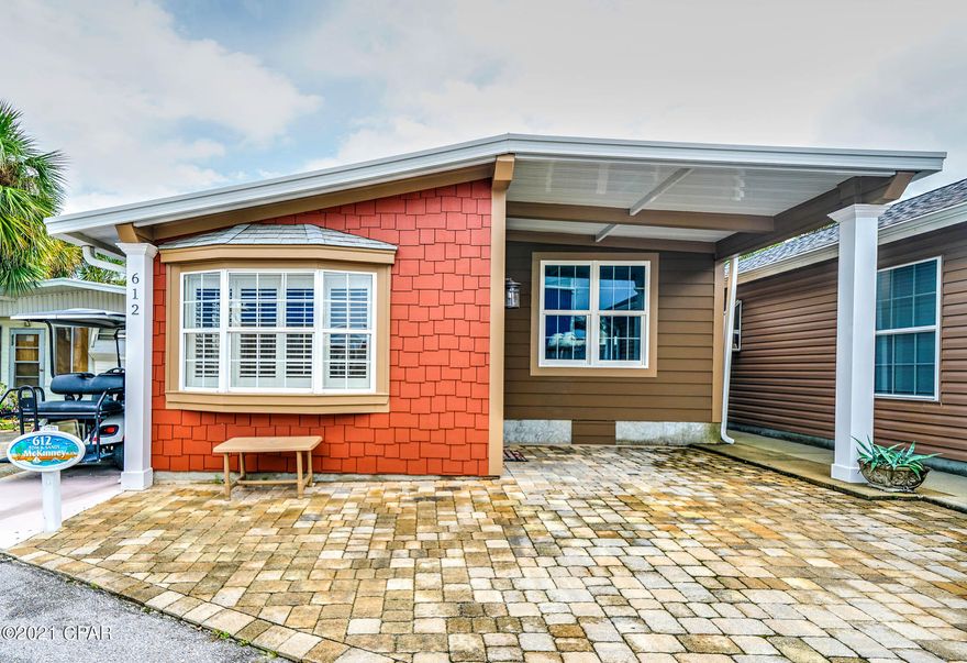 CURRENTLY UNDER CONTRACT, SELLER ACCEPTING BACKUP OFFERS - Check out this beauty in the Venture Out!  This 3 bedroom, 2 bath is super spacious and move in ready. The kitchen is large with stunning cherry cabinets.  The living room is spacious, light and airy as well.  New roof in 2018 and new HVAC recently.  Perfect for your second home or investment property! Venture Out offers BOTH beach and bay access! The resort has 2 pools, tennis, golf, shuffleboard, playground, basketball, fishing pier, boat dock with slips & boat ramp. Venture Out is a golf cart community that has exploded in popularity within the last few years. A gated, pet friendly community that's great for full time residency or just to vacation. 24 hour security as well!