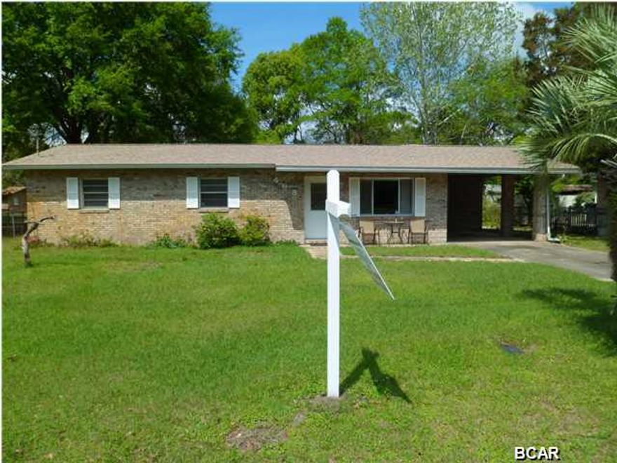 PRICE REDUCED ON 10/7/15! Perfect Starter Home! Simply put, there's just not many homes this nice at this price available right now. Great starter home or investment property for rental. Move-in ready 3 bedroom, 2 bathroom home in a quiet neighborhood. Cute ''eat-in'' kitchen with additional dining area in great room area. Great Room has a beautiful wood-burning fireplace for those chilly winter nights. Strong brick over block construction, well insulated, new roof in 2011, AC serviced in 2012. Includes a sturdy carport & an outside storage shed. Sliding glass doors lead out to a large screened in back patio overlooking a large backyard that just begs for a swing  set, trampoline or pool. (Let's not forget the two mature, productive orange trees on the property!) Washer, dryer conveys. all included in the sale price. This is a very well kept home just waiting for the right family to move in!