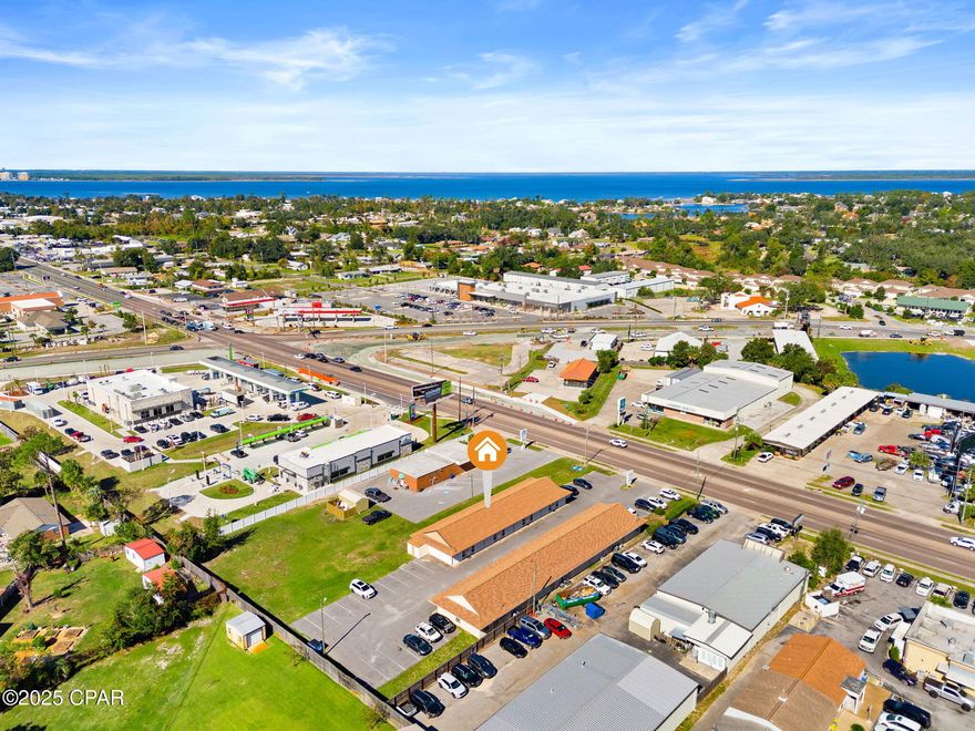 Located along one of Panama City's busiest commercial corridors, this professional office property offers exceptional visibility and accessibility with an Average Annual Daily Traffic (AADT) of 26,000 vehicles. The building totals 3,360 square feet of heated and cooled space, divided into four individual office suites of 840 square feet each. Zoning is GC-2. New roof installed in 2019. 

Currently, Suites E and F are leased, providing immediate income, while Suites G and H are vacant and move-in ready ideal for an owner occupant seeking to offset expenses with rental income or for an investor ready to lease out the remaining space.

Its location on W. 23rd Street positions it within minutes of major retailers, restaurants, and other professional services, making it a strategic choice for any business or investor seeking stability and visibility in the heart of Panama City's commercial district.