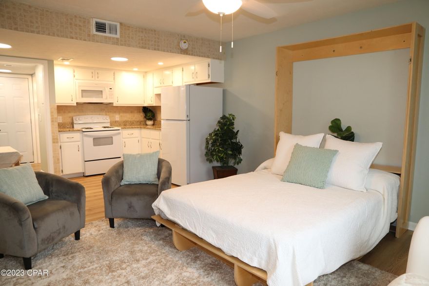 WHY RENT WHEN YOU CAN OWN WITH   MONTHLY PAYMENTS OF $699.21.   (Owner financed with $49k down, $100,000 loan at 7.5% interest, 5 year balloon).  COMPLETELY RENOVATED IN 2023!!   New flooring, All new windows, new doors, New furniture (FULLY FURNISHED).   New Granite kitchen countertops, new appliances, under-mounted sink.  Washer/Dryer added.  BATHROOM WAS COMPLETELY GUTTED AND REMODELED in 2023.  
Studio condo with Murphy bed.  Just off North Lagoon Dr.  HOA dues under $200/mo.