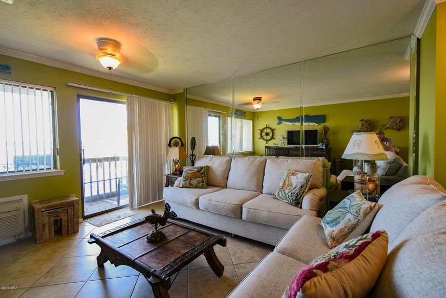 CURRENTLY UNDER CONTRACT - SELLER TAKING BACK UP OFFERS  Take a look because these don't come on the market often! Bayfront condo with amazing sunset views right from your balcony and a Bayfront pool! Located across the street from Gulf Coast State College, The FSU Panama City Campus and just minutes from Historical St Andrews, the World's Most Beautiful Beaches and by boat, just minutes from Shell Island, the pass and Gulf of Mexico, this condo boasts crown molding and ceramic tile floors throughout. The updated bathroom includes a pedestal sink and tile shower with insert. Verify measurements if important.