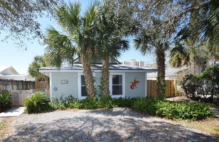Here is your chance to own a Well Maintained Beach House with an in-ground POOL (installed in 2014). This lot is one of the prettiest you will find on the beach, With a canopy of beautiful Oak trees as you enter the property. The Driveway has room to park your boat or water toys This home offers a Pool, Metal Roof, Tile throughout, Granite Counter Tops in Kitchen, Hurricane rated Windows and 8' Sliding Door, Fenced back yard, Roll out Sunsetter awning installed 2014, New storage building installed 2015 and Stainless Steel Appliances. This home has two bedrooms and one and a half baths. The guest bedroom is large enough for two full size beds plus chest and dresser. A spacious kitchen that is open to the living area with views of the pool. The Clothes Washer and Dryer are included. Close to Shopping, Dining and Entertainment. Three blocks from the Safari Boat
Ramp and Four blocks to a public access to the Beach. This one has it all.( No Showings Before April 1st)