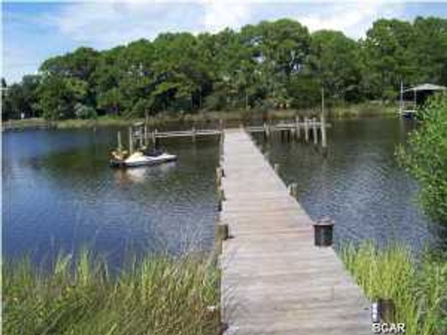 Plaza's of St Thomas is right on Grand Lagoon and across the street from the beach! Great location for a vacation home or short term rental. All the conveniences of Thomas Dr. are at your fingertips with its restaurants and shops. And this complex is abounding with amenities including community pool, tennis courts, retail shops, boat dock with deep water access, pet walk, fishing, BBQ grill, community room, shuffleboard, and much more! This one want last long.