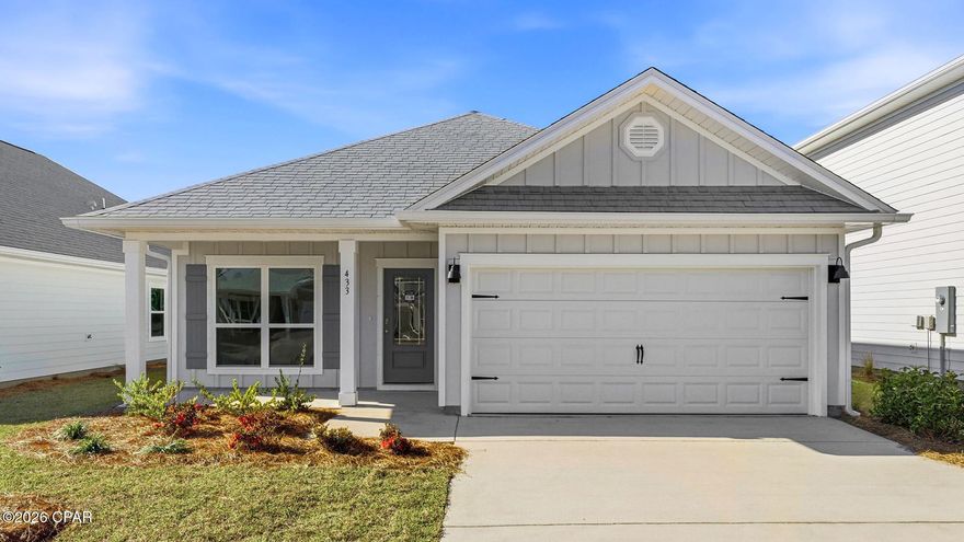 Welcome to 433 Wolcott Way, located in the Bayside at Ward Creek community in Panama City Beach. This home is ready for move in and has just the right amount of open space for entertaining. As you enter the foyer, you are greeted by a flex space with a large picture window that allows the beautiful Florida sunshine to fill the front of the home. 

Continuing down the hall you will see the open concept kitchen, dining, and living area, complimented with vaulted ceilings which lend a grand feel to the heart of the home. This home has EVP flooring throughout which creates a seamless transition between rooms. The kitchen is accented with white cabinetry that is complemented by the quartz countertops and a center island. 

Nestled at the back of the home for privacy, is the primary bedroom with a spacious ensuite bathroom. The primary bathroom has a walk-in closet, soak tub, dual sink vanity with lower cabinetry and quartz countertops, and a separate shower. The additional bedrooms are located in an adjacent hall just off the kitchen and dining area. Here you will also find the full guest bathroom, linen closet for extra storage, and the laundry room with shelving above the washer/dryer hookups. Entertain with ease under the covered back patio, accessible through the full glass backdoor in the living room.