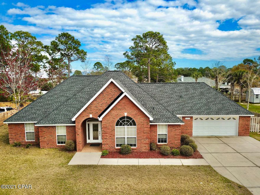 Beautiful brick home centrally located on Panama City Beach in the desirable golf course community of Colony Club. A short golf cart ride to the golf course or the beach.  This brick home is low maintenance, has an oversize two car garage, & plenty of room in the back yard for a pool.   Bring your boat or motor home and park it right behind your double gate privacy fence. No HOA.  Spacious master bath, his/hers walk in closets with a nice walk in shower. The living room & patio area are wired for surround sound and LVP in the living room & dining room. Brand new carpet in all the bedrooms and a fresh coat of paint. Down the street from Gail's Trails A network of paved trails for biking, walking or running. Short drive to Pier Park this home is as central as you can get. New roof HVAC 6 yr