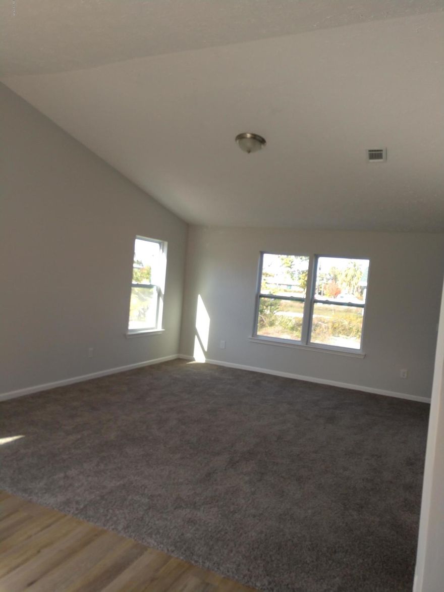 Move in ready! The house is fully rebuilt after hurricane Michael.  New shingles  roof, new flooring-vinyl plank and carpet in living room, and the 3 bedrooms., New  stainles steel appliances.   New paint through out.  New ceiling fan.   New water heater  and AC.   New counter tops, new roof and huge laundry room.   Cathedral ceiling,  New fence on the North side and on the front of the house.

Seller is ready to sell.  Bring offers.