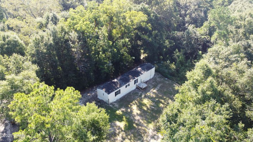 A 2010 3-bedroom 2-bath home on a beautiful, wooded 1 acre lot. Paved road access. New updates and improvements have been completed in the past few weeks. It is ready for your cosmetic touches. Would make a great property for long term rental. County water and all the plumbing works. Hvac works. Cash offers only. Priced to sell.