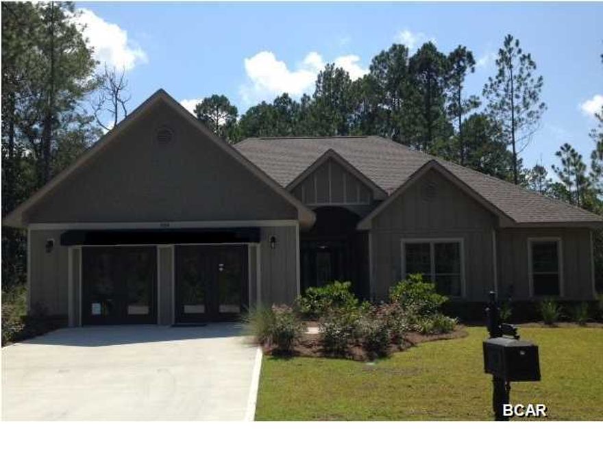 ONLY 12 homes available in this highly desirable, St. Andrews Bay front community across from Tyndall AFB! Laird Point is a gated, quiet coastal community yet close to shopping, dining and banking. The Jamison Plan is the single level 4 bedroom 2 1/5 bath home you have been looking for on a 1/3 acre lot. Large family room, spacious kitchen with large corner pantry, breakfast bar overlooking the breakfast room. Plus a formal dining room and large laundry room. This Jamison has large tiled sunroom. Nicely adorned with granite counter tops, 5'' wood flooring, 18 x 18 tiles, tiled master shower, under cabinet lighting, exterior flood light, pendant lights over the bar, recessed exterior can lighting, G E stainless steel appliances, lever style door knobs and inside wall pest control system