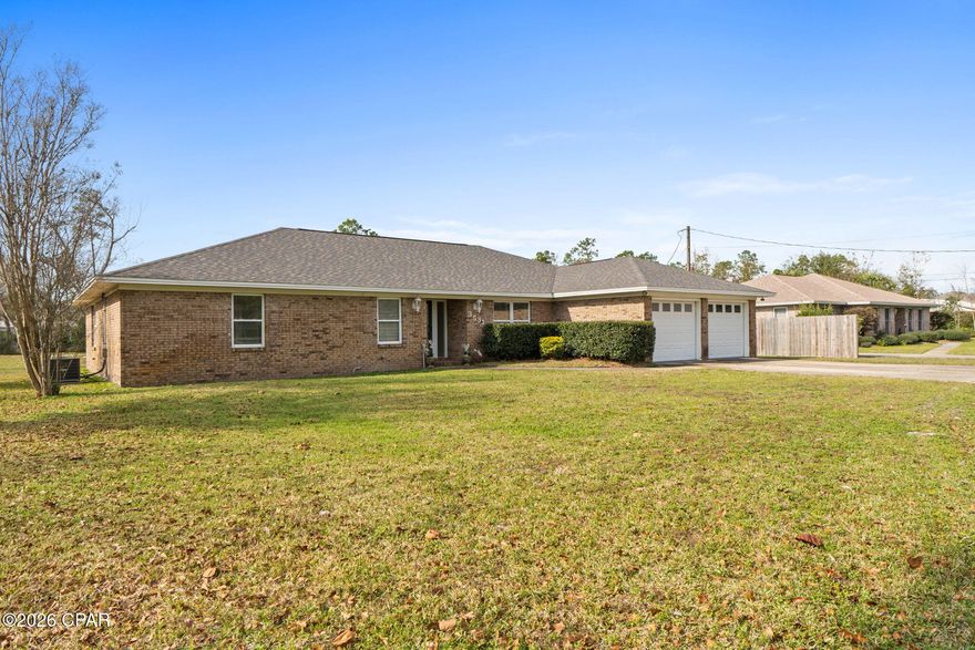Secure your opportunity to own this all-brick home perfectly nestled on over ¾ of an acre with no HOA. Located in the heart of Panama City, this property offers the rare combination of space, versatility, and convenience, just minutes from schools, shopping, dining, and everyday necessities.

A standout feature of this home is the detached shop with electricity, providing a highly versatile space that could easily be converted into a mother-in-law suite, guest quarters, or a 4th bedroom. The expansive circular driveway offers ample parking for family, guests, boats, or RVs, while the generous outdoor space creates endless possibilities for expansion, entertaining, or future improvements.

Inside, the inviting great room features a cozy wood-burning fireplace, perfect for relaxing evenings or family gatherings. The recently updated kitchen showcases custom cabinetry, stainless steel appliances, and beautiful granite countertops, combining modern style with everyday functionality.

The spacious primary suite includes a private bath and direct access to the backyard, while two additional bedrooms provide comfortable accommodations for family or guests. Step outside to the screened-in porch, where you can unwind and enjoy peaceful views of your expansive backyard—ideal for entertaining or quiet moments surrounded by nature.

Additional highlights include a new roof (2019) and the freedom that comes with no HOA restrictions. Homes offering this much land, flexibility, and location are increasingly hard to find.

Don't miss this rare opportunity to own a beautiful home with endless potential—schedule your private showing today!