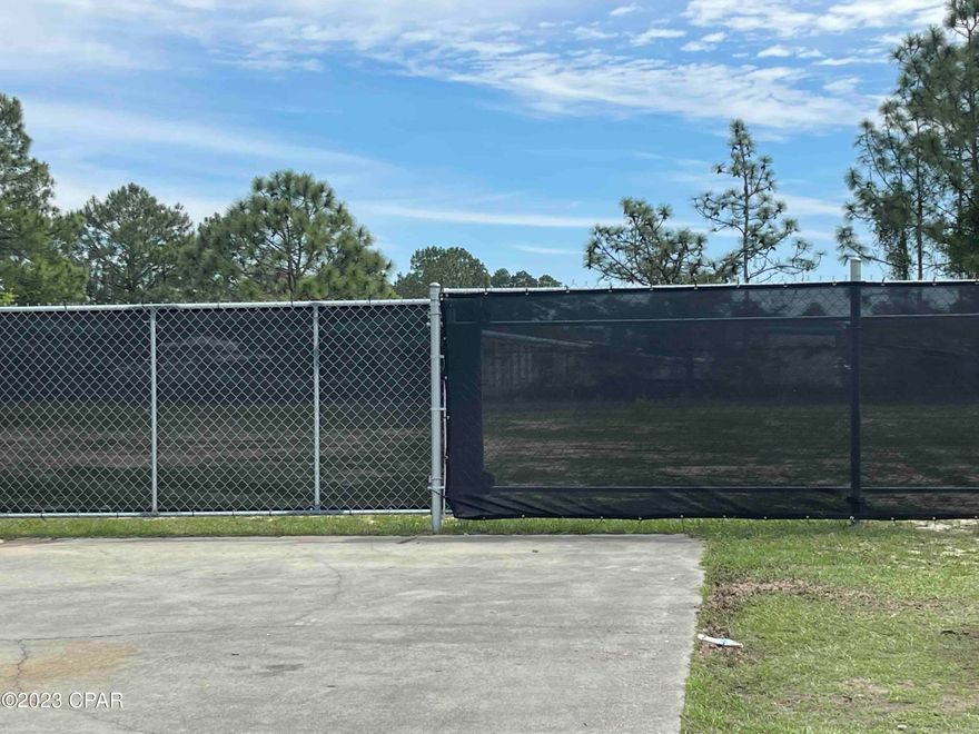 1 Acre fenced yard available for lease in Panama City Beach, FL. This Lay down-storage yard has a new 6ft screen lined chain link fence with two (2) 12ft rolling gates and paved access to the yard.  The yard also has 30'x75' cement pad for heavier equipment.  Riviera Commerce Park currently has two (2) warehouse units with office and bathroom that are available for lease.  One is 3000 sf and the other is 7500 sf.  Please see CPAR MLS #740394 and #736739 for info. on the available warehouse spaces.