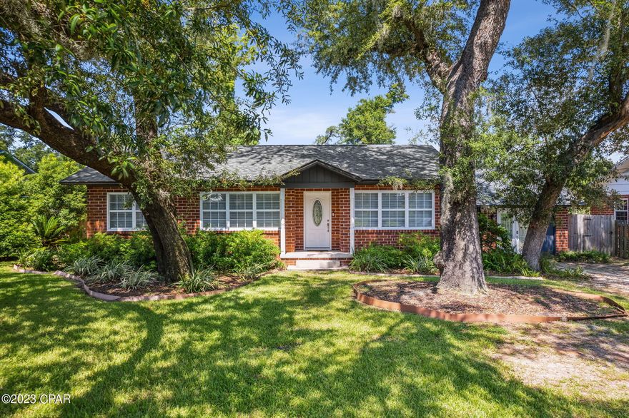 CURRENTLY UNDER CONTRACT, SELLER WILL CONSIDER BACKUP OFFERS Welcome to this delightful brick home at 1603 Dewitt Street in Panama City's cherished Cove neighborhood— all set for you to move in and enjoy. As soon as you enter, the living and dining area welcomes you with its bright and open feel. Generous windows and French doors open to a deck that extends your living space into a green backyard paradise.

Just off the living area is a cozy space featuring a fireplace, window seat, and custom shelving, perfect for relaxing. The kitchen features white farmhouse cabinets, contrasting beautifully with quartz countertops and stainless steel appliances. And, for your convenience, a multi-purpose laundry room also serves as a mudroom with backyard access.

This home offers the best of both worlds—original hardwood floors that add a classic touch and new LVP in the living, dining, and hallway for a modern feel. The floor plan offers privacy and relaxation. The main suite is spacious, with generous closet spaces. Plus, it has its French doors leading out to the backyard oasis. Another standout feature is the Closed Cell Insulation installed under the entire house's crawl space, which enhances the home's energy efficiency and contributes to a more comfortable indoor climate year-round, reducing your heating and cooling costs. AC unit was installed December, 2022.

Want a smart home? This place has a Wyze doorbell, sprinkler system, thermostat, and side door—all remotely controllable. And let's talk location—it's near schools, close to boating facilities, and just a short ride to downtown. Not far from St. Andrew Bay Yacht Club, local restaurants, shops, hospitals, and just 10 miles from Tyndall Air Force Base. Schedule your private tour today and see why this Cove gem is a must-see.