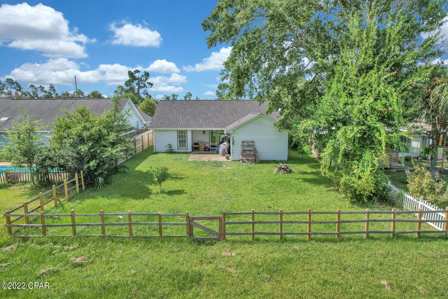 Motivated Seller! This charming, Panama City Beach home, located in ''Heritage Village: community could be your new primary or secondary residence. Short term and long-term rentals allowed. Convenient to the beach side and town side. This 3-bedroom, 2-bathroom home features newer LVP flooring and a new roof as of 2019! The home offers an open floor plan, equipped with a spacious living area, high ceilings, and an open kitchen with stainless steel refrigerator and dishwasher. The home features a two-car garage and much more! There is room in the large backyard to add a pool is desired. All measurements are approx. and should be verified if important.