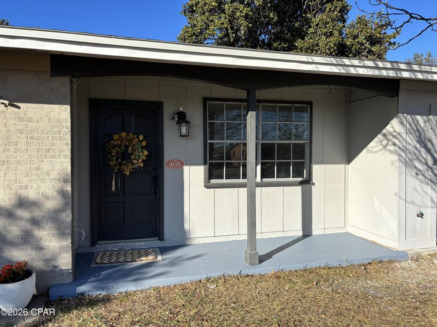 Solidly constructed with concrete block exterior walls and a classic brick front, this well-maintained 3-bedroom, 2-bath home offers fresh interior paint and tile flooring throughout for easy, low-maintenance living. The functional floor plan provides comfortable everyday living with efficient use of space.
A nice Screened in Patio, well maintained, allows for the best bird watching from the backyard with the surrounding mature trees.

The primary bathroom has been recently updated with a walk-in shower, and the hall bath features a tub/shower combination. Major improvements include a new water heater installed by Peaden 2026, a gas furnace only a few years old installed by Peaden and recently cleaned 2026 by Peaden, and roof replaced in 2019. The kitchen includes a new electric stove/oven and gas plumbing is already in place and capped allowing for a future gas range conversion if desired.

The refrigerator will be relocated to the garage and may serve as a secondary unit. Buyers may install a new refrigerator in the kitchen to suit their preferences. The single-car garage includes a utility room with additional storage, and the attached carport provides extra covered parking for vehicles or recreational equipment.

Enjoy the spacious backyard with fencing on most sides, offering both privacy and versatility for outdoor living. Conveniently located just minutes from shopping, dining, and grocery stores, approximately 7 miles from Tyndall Air Force Base, and about 3 miles from Under the Oaks Park and nearby recreational amenities in Callaway and Parker.

This move-in ready home reflects pride of ownership, quality construction, and thoughtful updates.