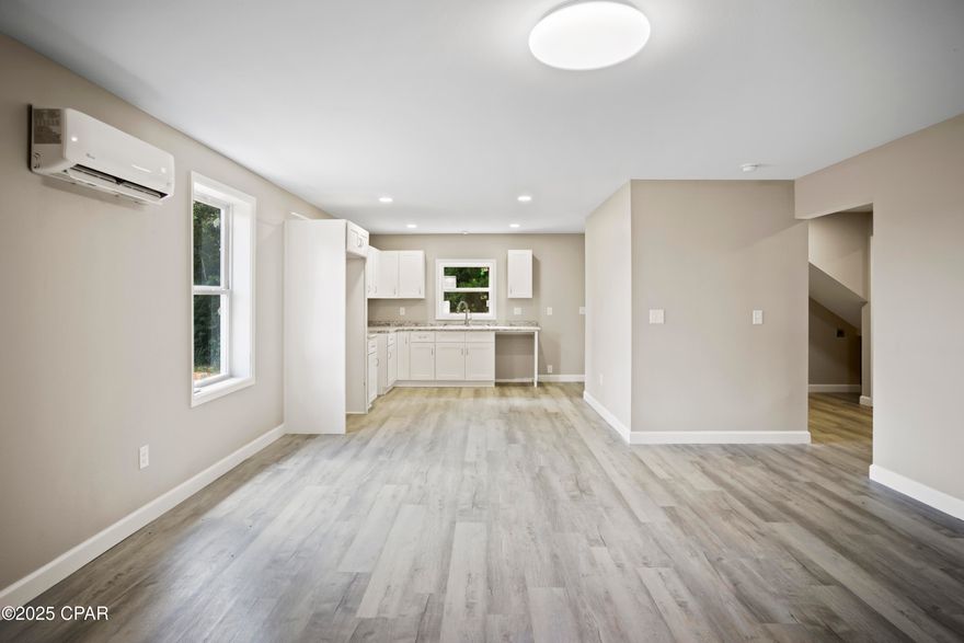 New construction 2025 • First-floor bedroom suite • Open living area • Mini-split HVAC • Covered porch • 3.0 mi to Garden of Eden Trail • 2.5 mi to Apalachicola River • No HOA

This newly completed 2025 contemporary home in Bristol offers a bright, open layout designed for both everyday living and easy hosting. A first-floor bedroom suite sits just off the main living area, with a second bedroom and compact bunk room upstairs for flexible use. The kitchen and living room flow together for a connected feel, complemented by durable block construction, a slab foundation, and efficient mini-split HVAC. A covered front porch adds a welcoming outdoor space, and the 0.28-acre lot provides room to personalize. Public utilities are connected, and the home has no HOA restrictions. Outdoor destinations nearby include Garden of Eden Trail at 3.0 miles, Apalachicola River access at 2.5 miles, and Torreya State Park trails within 14.0 miles. St. George Island beaches are about 45 miles away.