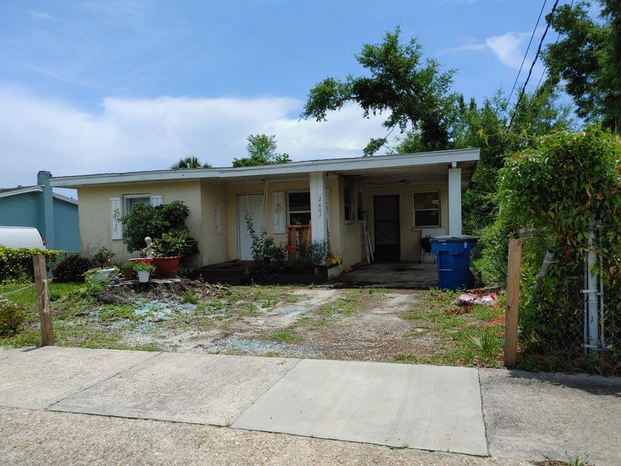 2 Bedroom, 1 Bath home with large, fenced back yard and new tar-down roof. Home features original pine flooring, some LVP, Pantry, Carport, Large laundry room, Central heat and air.  Tenant occupied but can be vacant with short notice. This home is within walking distance to St. Andrews marina, shopping and restaurants.