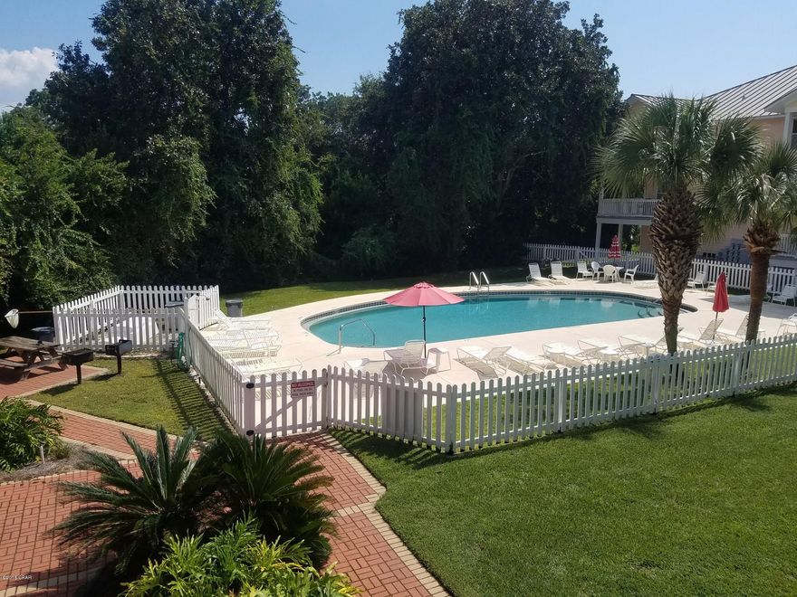 Tucked away in a quiet setting with whitewashed fences, lush greenery and a sparkling, refreshing pool, Peachtree Place II is a low-rise complex and a favorite of those who are in love with the West End and all it has to offer. Located across the street from Beach Access 73 and just a few miles from Pier Park, this immaculate, spacious, ground floor condo offers 2 bedrooms and 2 full baths, BRAND NEW A/C, water heater, stainless steel appliances and a POOL VIEW! There is additional storage off the back patio as well. Measurements should be verified if important.