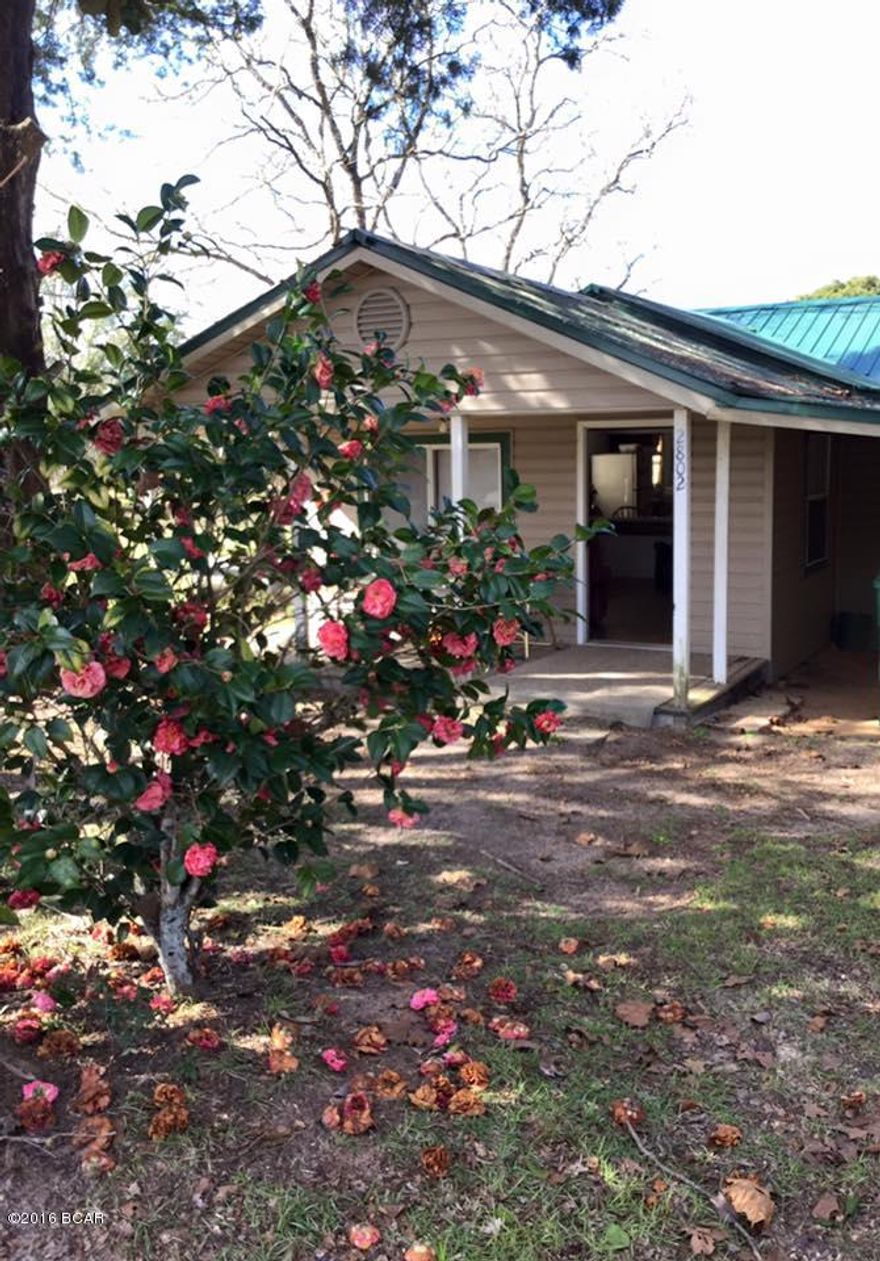 Well-maintained 3B/2Ba home on large lot! This home features 3 nice bedrooms, a charming front porch, a large back porch, tile flooring throughout the main living areas, and many beautiful mature trees. Wausau is less than an hour from ''The World's Most Beautiful Beaches'' and it's also known as the ''Possum Capital of the World'', which is celebrated annually during their Possum Festival. If you are looking for a full-time home in a small city close to Panama City, then don't miss your opportunity to view this property. Call today! PLEASE NOTE that the actual numbers on the house say 2802 (Property appraiser site states 2806.) All measurements believed to be true and accurate-please verify if important.