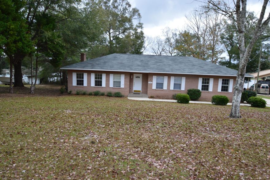 Well maintained waterfront home on Dogwood Lake... Custom built 2 bedroom 2 bath home brick home, with spacious living/dining area with nice hardwood floors. Fireplace with gas insert.Enjoy evenings in the Florida Room or screen porch overlooking lake. Property has nice dock with small out building. Home has newer roof. No gasoline motors in lake...