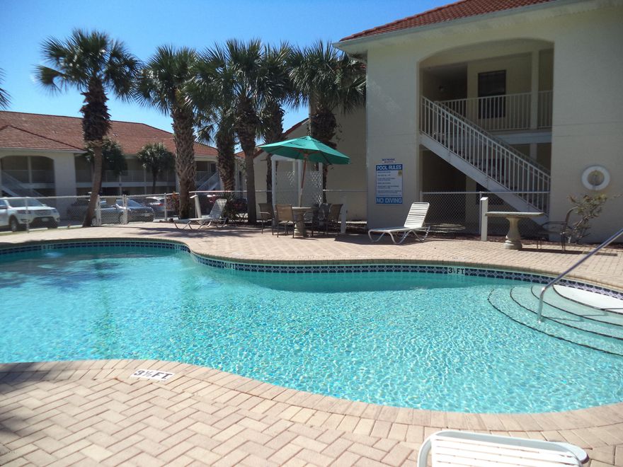 Poolside unit in Horizon South! One of the best locations in the complex.  Park in the front, step out your back door to the pool!  Two bedrooms, two baths, two bunks.  Spacious kitchen with bar and wonderful living room space.  The covered front porch gives you access from the living room and the bedroom.  Just steps to the worlds most beautiful beach!  White sand and a bright blue gulf.  What are you waiting for?  Relax and enjoy when you purchase this wonderful condo.  Rents very well too! Putt putt, tennis, hot tub, four pools, game room, and more!  Approx. 2 miles from Pier Park.  MORE PHOTOS COMING SOON!