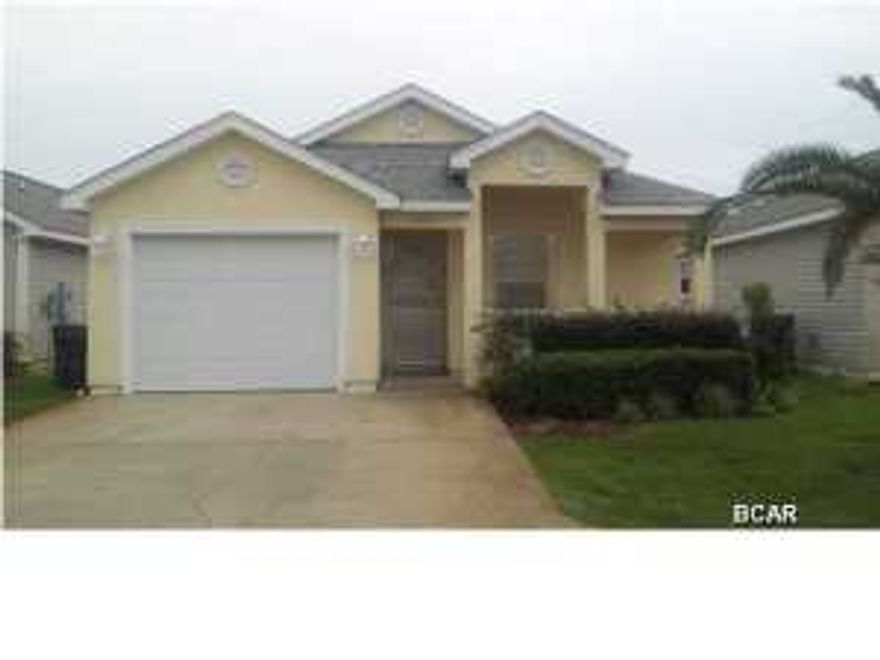 This is a beautiful 3 Bedroom 2 Bath home in immaculate condition one block from the beach -- offered by the original owners, utilized as a winter home and never rented! It is being sold with all furnishings. With upgrades to include: ceramic tile in the entry foyer, kitchen and both bathrooms hurricane window coverings for all windows and French doors to the screened porch. Kitchen area is roomy with a pantry and breakfast bar. A separate dining area is adjacent to the spacious living/family room which overlooks the screened porch. The oversized master bedroom adjoins the large master bathroom with dual vanities, walk-in closet and glass-door walk-in shower. The two additional bedrooms are adjacent to the second full bathroom. The one-car garage has an automatic door opener and