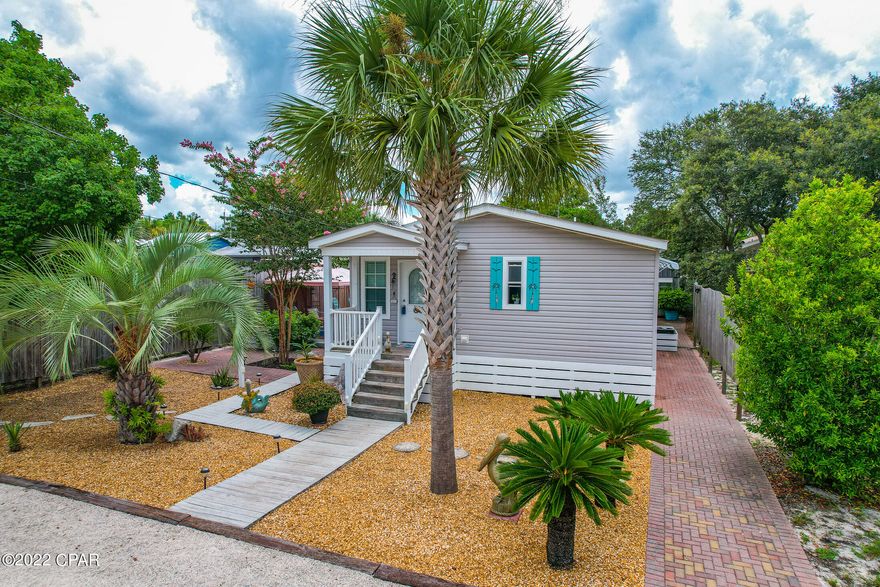 CURRENTLY UNDER CONTRACT.SELLER TAKING BACKUPS

The affection & care that has been put into this home is apparent from the 1st glance of the outside through the entire home. As you enter this lovely  home you can feel the love! The absolutely adorable home is being sold completely Furnished  with Beachy decor'. Other great features include an open floor plan,split bedrooms with a fabulous Master suite & new Hvac! The dining area has a sliding door that opens to the incredible yard.The outside is welcoming with the manicured pavers ,rocks and plants. There are two sheds and a screened gazebo that convey with the home. The parking area is perfect for  company & beach  toys. Awesome location! Only a few blocks to the beach,a few minutes to the 30A corridor and Carillon Beach. Come s