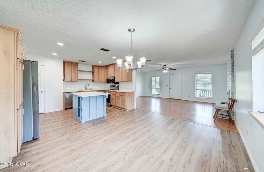 Looking for space and privacy but still want to be close to town? This 3-bedroom, 2-bath home sits on 1 cleared acre with 3 more acres of untouched land—all fenced and ready for whatever you have in mind. You'll love relaxing on the front porch swing or the screened back porch, and there's even some blueberry bushes for a little extra charm.

Inside, the kitchen has quartz counters (2022) and all new appliances (2022). Windows were replaced in 2023, HVAC updated in 2012, and a walk-in bathtub added in 2019. The home also comes with a Culligan water system (owned, not leased). Cozy up to the wood-burning fireplace, which currently has an electric insert, and enjoy the easy-care laminate and vinyl flooring throughout.

Property includes a 14' x 18' shop with three open bays—perfect for storing vehicles, boats, tractors, and more.

Built of block with stucco, this home is solid and move-in ready. You get the best of both worlds—peaceful country living with shopping and restaurants just minutes away.

All measurements are approximate; buyer to verify if important.