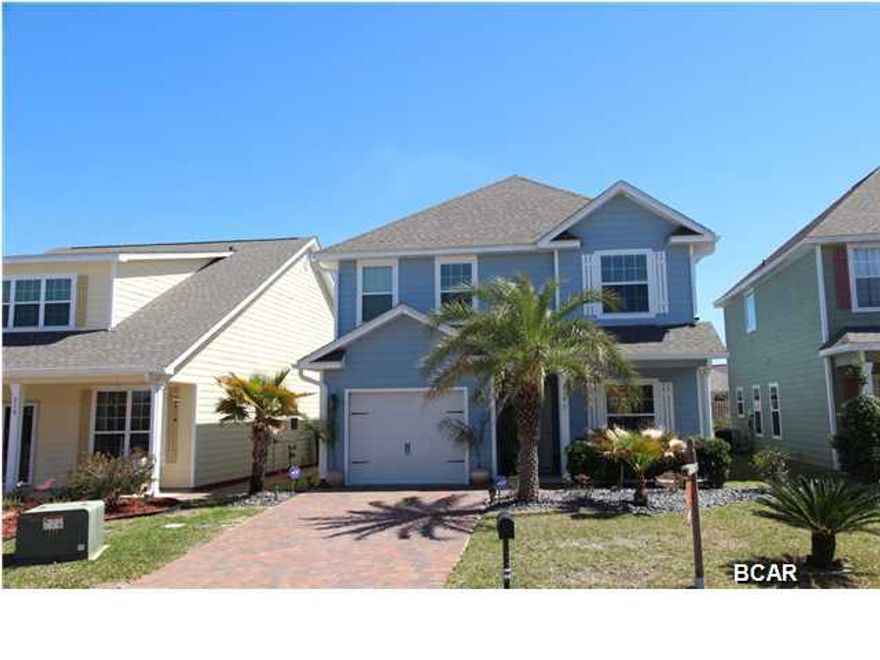 BACK ON MARKET - REDUCED $5,000.  Beautiful 2-story Turtle Cove home with 4 bedrooms plus very large bonus room upstairs and 3.5 bathrooms. MASTER ON THE MAIN FLOOR. The shower in the master bathroom is tiled all the way to the ceiling with frame-less glass doors. Kitchen is open to the living area with room for 4 bar stools. GRANITE COUNTER TOPS in all 3.5 bathrooms and in the kitchen. Second master bedroom upstairs. Stainless steel appliances, crown molding, hardwood floors, tile and carpeting, wood cabinets in kitchen, SECURITY SYSTEM with cameras. This home has a GARAGE, gutters and is fully fenced in the back. Other exterior features include brick pavers on the driveway and round rock (instead of pinestraw) at the front of the home, automatic sprinkler system, hardiplank siding. in a great neighborhood. Easy to show, call your agent to set up the showing.