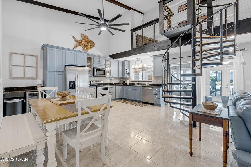 Phenomenal Vacation Rental just across the street from Beach Access #13 and the sugary sands of Panama City Beach Florida's emerald waters. Professionally decorated, this established VRBO is being offered fully furnished and turn-key, Rental Projection $196k/year. Open concept living, dining and kitchen with 18ft beamed ceilings and wood burning fireplace. Kitchen has been renovated with new granite countertops. The spiral staircase and slick modern railings, leads to the main bedroom which offers a romantic jetted garden tub, large walk in closets, and the best part, Gulf views from the balcony. The Florida room has French doors to the landscaped front yard, with pavers and cedar covered pergola above a large dining table and an additional sitting area to enjoy the breeze from the gulf. Tile floors throughout the entire first floor, the downstairs hallway leads to 4-bedrooms, 2 on each side with a shared bathroom in between, owners' closet and access to the garage and laundry room. There is plenty of parking for all your guests and attached garage with a custom built garage to keep a golf cart. This is a block house with Hardieboard siding that has been connected to the city sewer, roof was replaced in 2019, the 2 HVAC systems and 2 water heaters were replaced in 2018 as well as the kitchen appliances. Computer equipment in the office does not convey. All Information is deemed to be reliable, but is not guaranteed, buyer to verify if important.