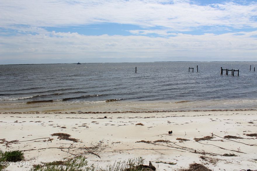 Small lot, Small price, Million Dollar view. Lanark Beach is where you want to be. Get your piece of paradise while you can. This part of the bay has deeper water, for better lot access. The fishing is phenomenal. You will never get tired of the sandy beach at your doorstep or the sunsets across Dog Island. Has public water and sewer. Ready for you to build your Florida cottage.