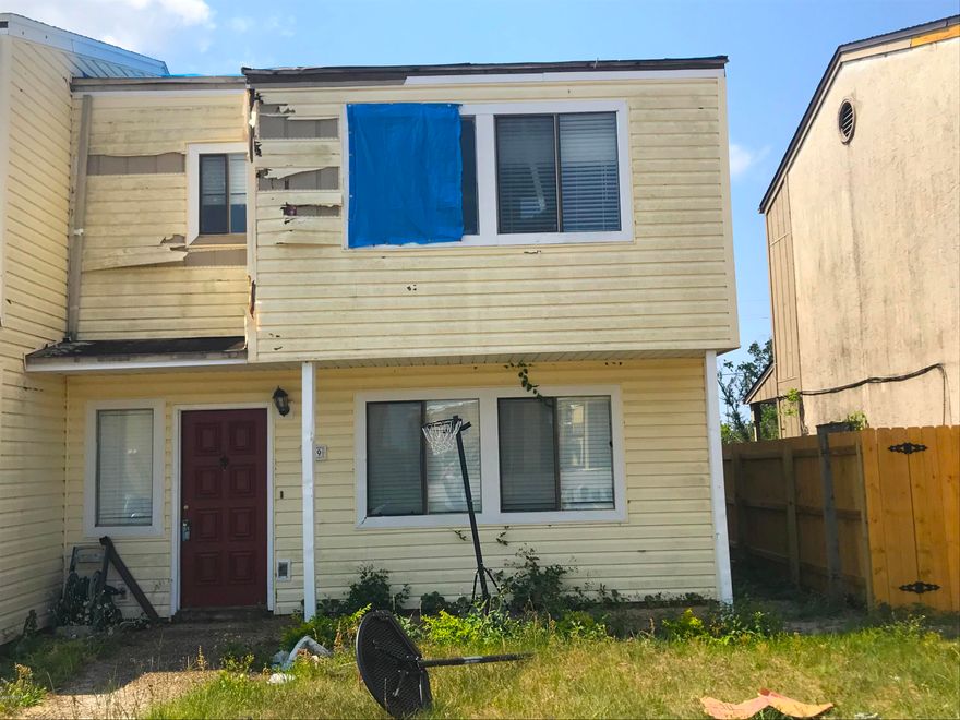 Great fix & flip opportunity here for a townhouse in Panama City! This townhouse is a 3 Bedroom / 2.5 Bathroom, 1,337 sq. ft. (heated) and 1,513 sq. ft. (total). It has beautiful vinyl wood and tile floors and a great open floor plan. The townhouse has some damage from Hurricane Michael and will require some drywall, ceiling, roof repair, etc. - but more than enough repair margin on this one. The townhomes in this complex have a stable ARV of $120K+, and they rent out for about $1,300 / month. With lots of people looking for residences in PC currently, this is an easy fix & flip / investment opportunity!     ----- CASH BUYERS ONLY -----