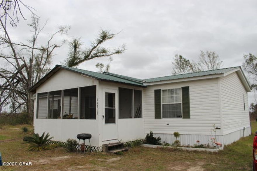 Double Wide Mobile home on one acre in a quiet neighborhood walking distance to Four Mile Creek Park. Updates have been made since ownership.  HVAC replace in 2011, Metal Roof in 2017, added front porch in 2016, Well replaced in 2019 and skirting & some siding replaced from hurricane Michael  along with tree debris.