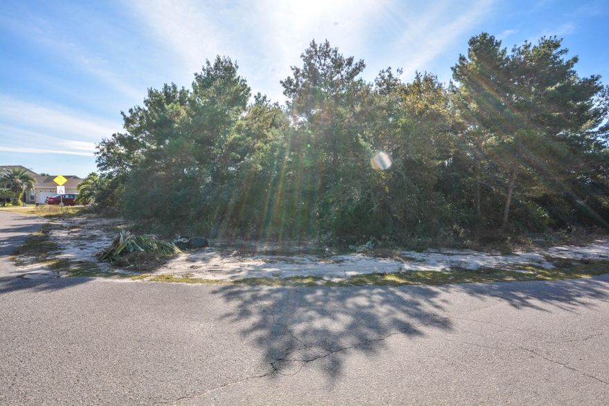 This low priced corner homesite is located in Seaclusion Beach where owners have the option of joining the Bid-A-Wee Beach Park for a

membership fee of $100 annually which allows them and guests the use of the gated, beach park with 2,500 feet of pristine beach frontage. The

yearly fee helps cover the cost of maintaining the crosswalks and sand dunes. The site is located an easy walk or golf cart ride to the gated beach

access. You will love the convenient location of this lot just minutes to Pier Park, Hwy 79 and two schools. This is the perfect site to build your beach

home or 'buy and hold' for future appreciaton.